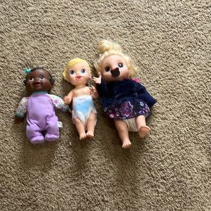 2009 baby alive, dolls, one bounces up and down and one other talks.